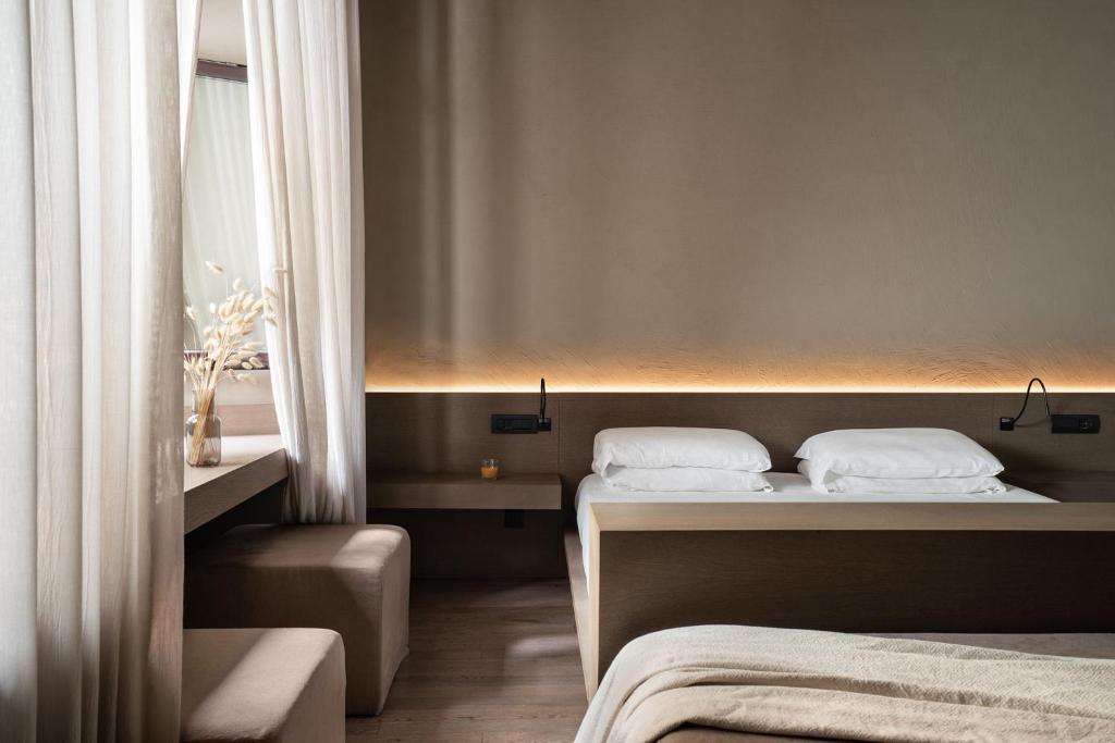 Postel nebo postele na pokoji v ubytování Hotel dei Barbieri