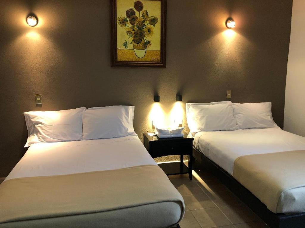 Postel nebo postele na pokoji v ubytování Hostel Inn