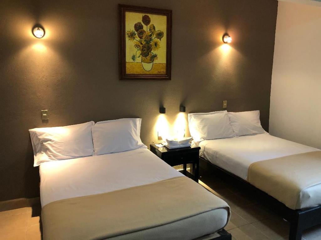 Postel nebo postele na pokoji v ubytování Hostel Inn