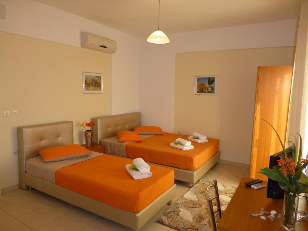Postel nebo postele na pokoji v ubytování Pavloudis Apartments