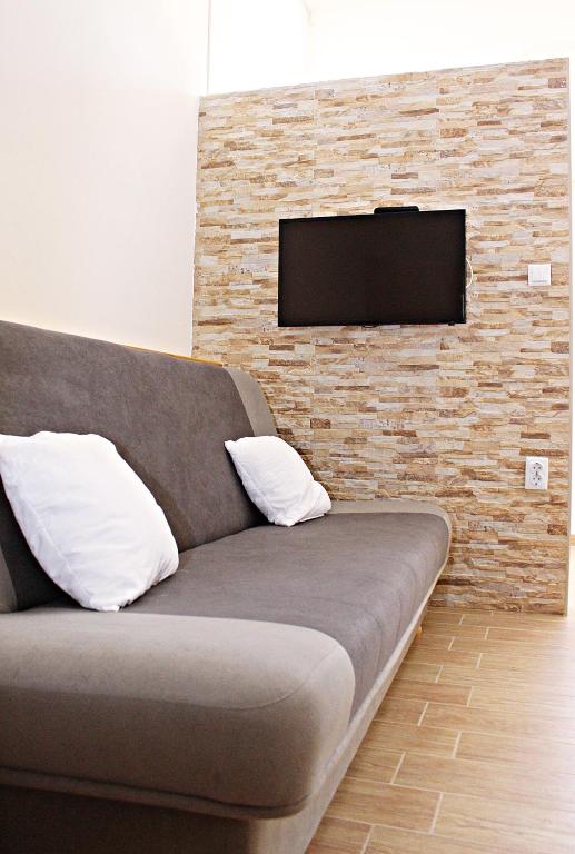 Televízia a/alebo spoločenská miestnosť v ubytovaní Studio Apartman Zara