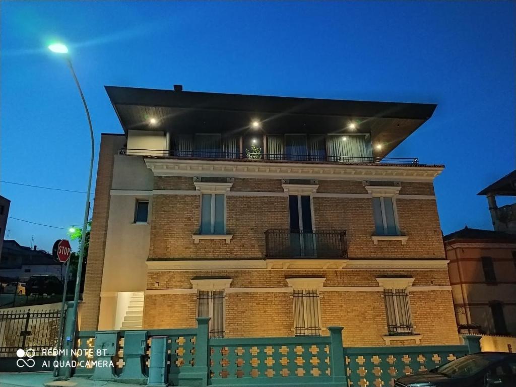 a brick building with a balcony on top of it at VILLA ACTEA in Vasto