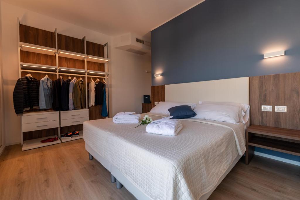 Postel nebo postele na pokoji v ubytování Hotel Mondial