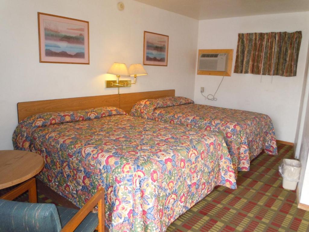 Postel nebo postele na pokoji v ubytování Value Inn