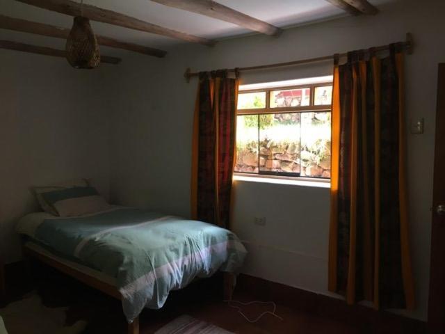 Postel nebo postele na pokoji v ubytování La Chakana Pisac