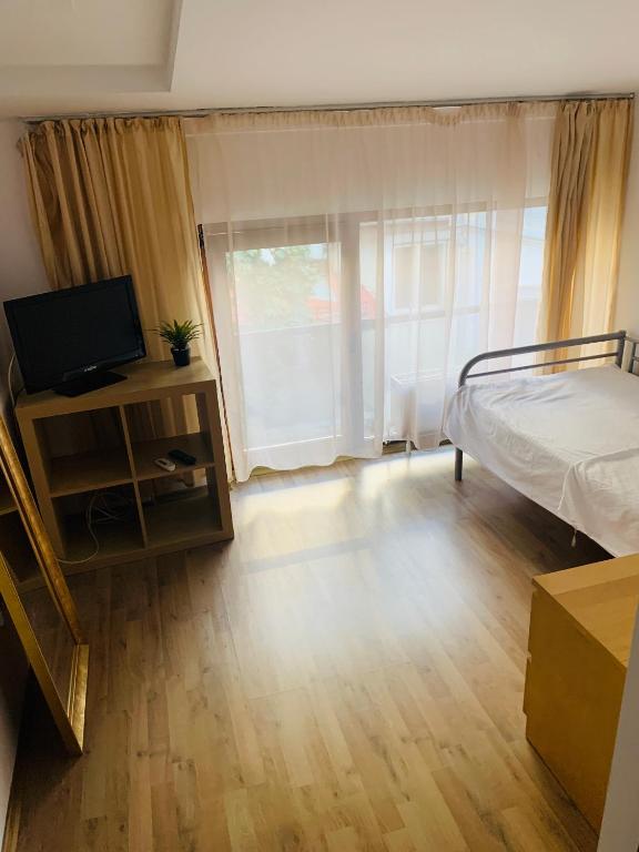 TV a/nebo společenská místnost v ubytování Happy Accomodation