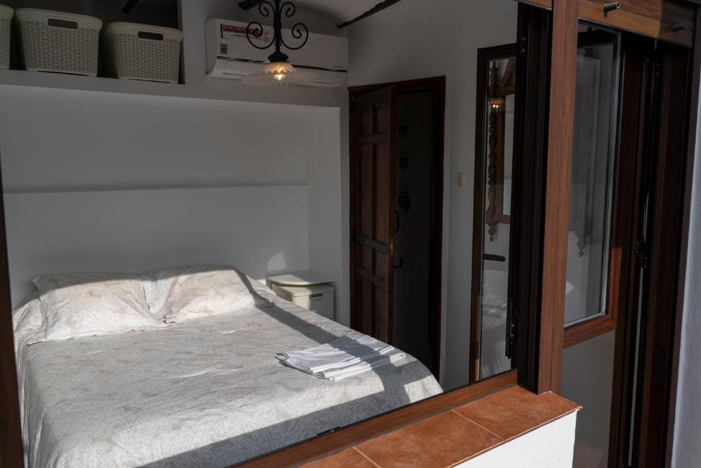Posteľ alebo postele v izbe v ubytovaní La Casa de la Tia Pilar