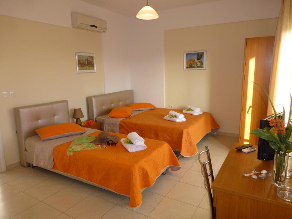 Postel nebo postele na pokoji v ubytování Pavloudis Apartments