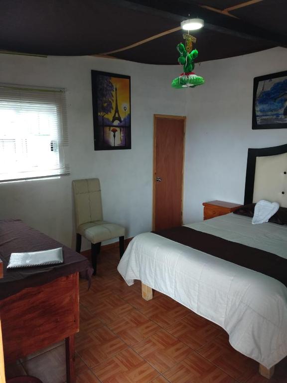 Letto o letti in una camera di Cabañas tipo habitación Planta Alta en Zacatlán