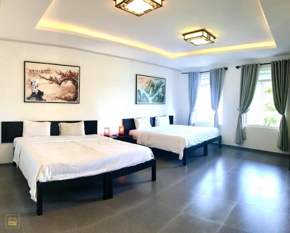 Кровать или кровати в номере Phu House