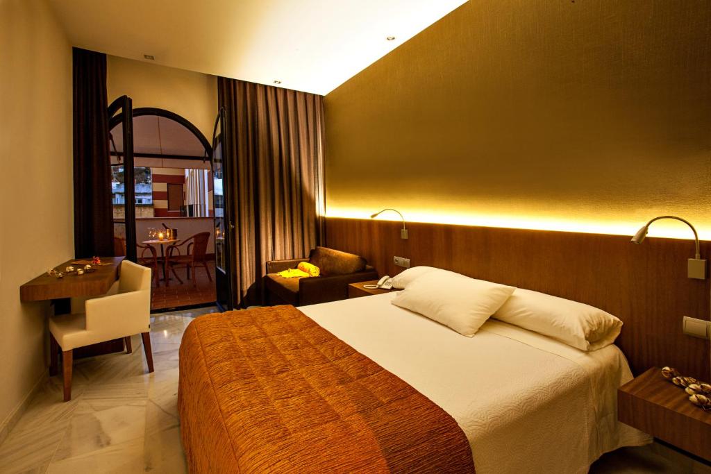 Posteľ alebo postele v izbe v ubytovaní Hotel Barrameda