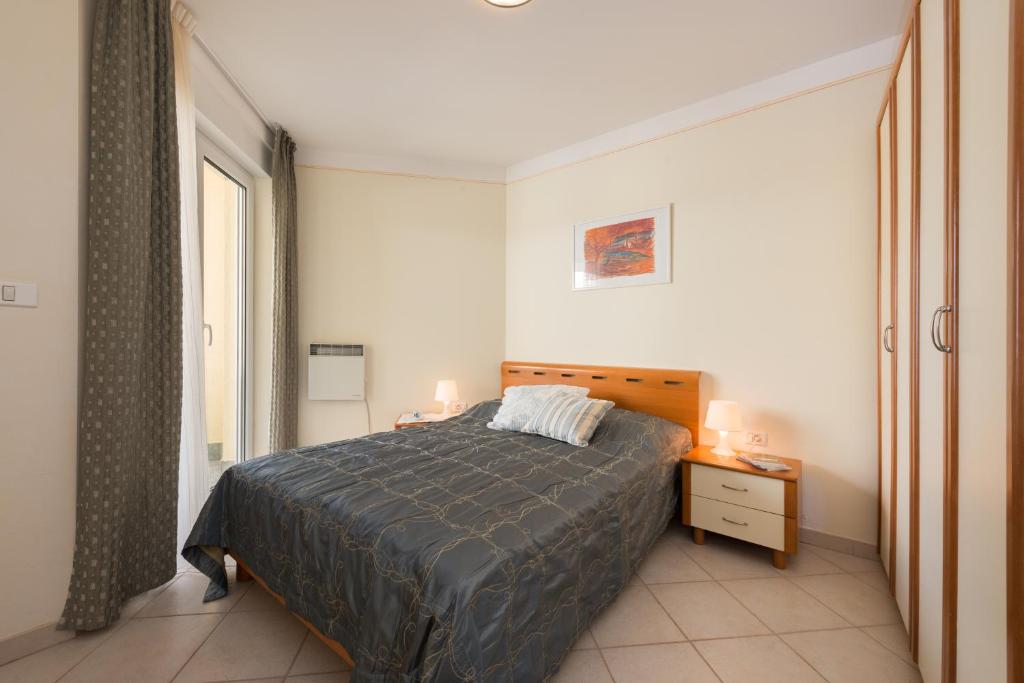 Giường trong phòng chung tại Skiper Apartments & Golf Resort