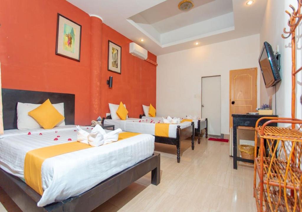 Postel nebo postele na pokoji v ubytování Best Central Point Hotel