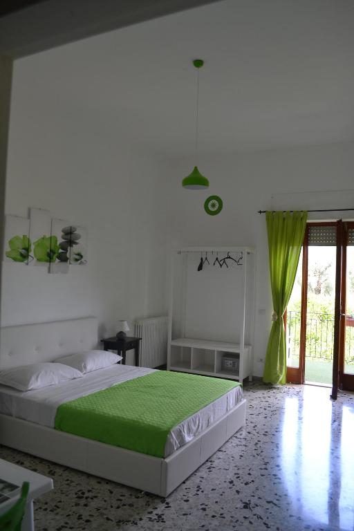 Postel nebo postele na pokoji v ubytování Sorrento Experience