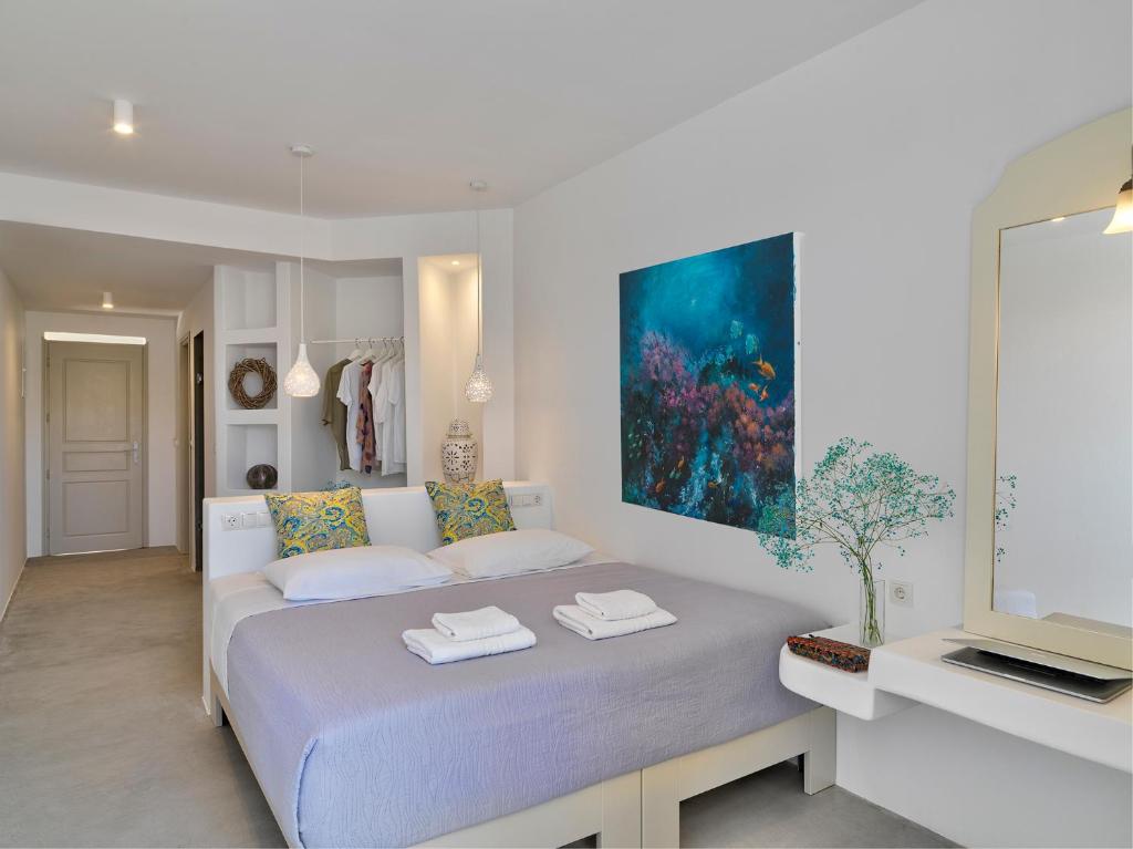 Postel nebo postele na pokoji v ubytování Aloni Hotel & Suites