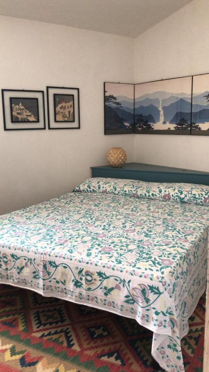 a bedroom with a bed with a blanket on it at Borgo delle Stelle in Scicli
