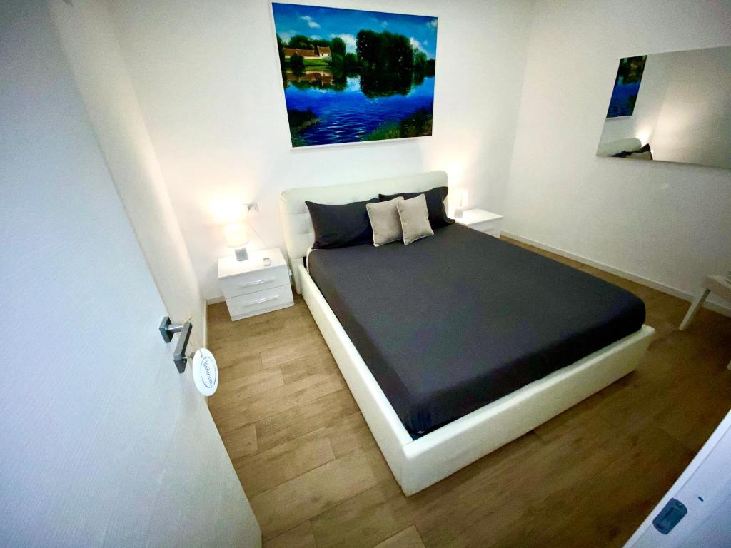 A bed or beds in a room at APARTMENT VITERBO CENTRO CORSO