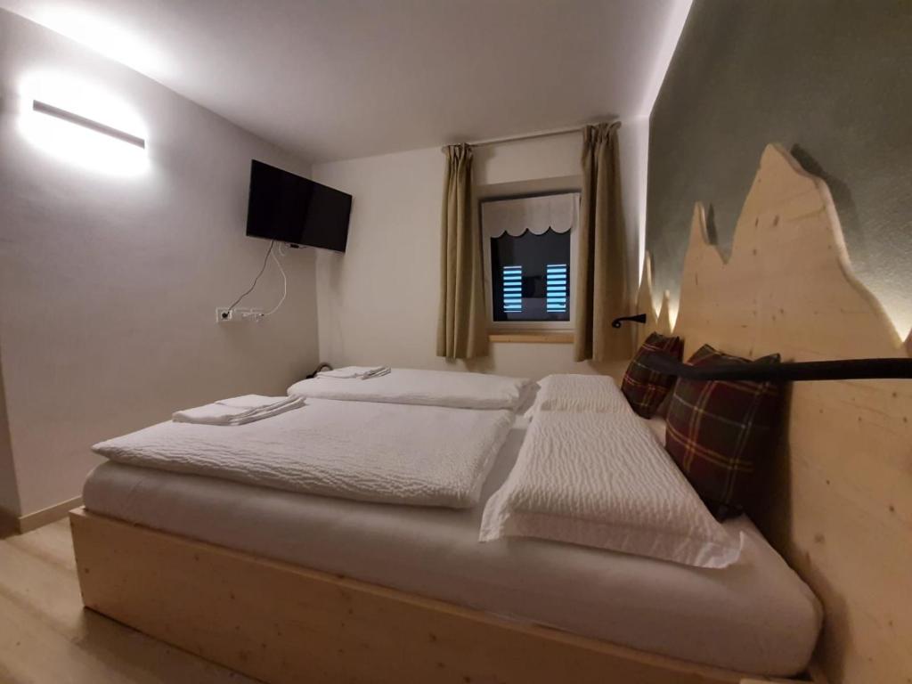 Posteľ alebo postele v izbe v ubytovaní B and B nonna Rosa vista Lagorai