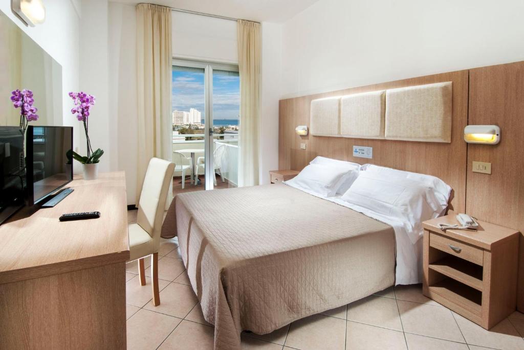 Postel nebo postele na pokoji v ubytování Hotel Cormoran