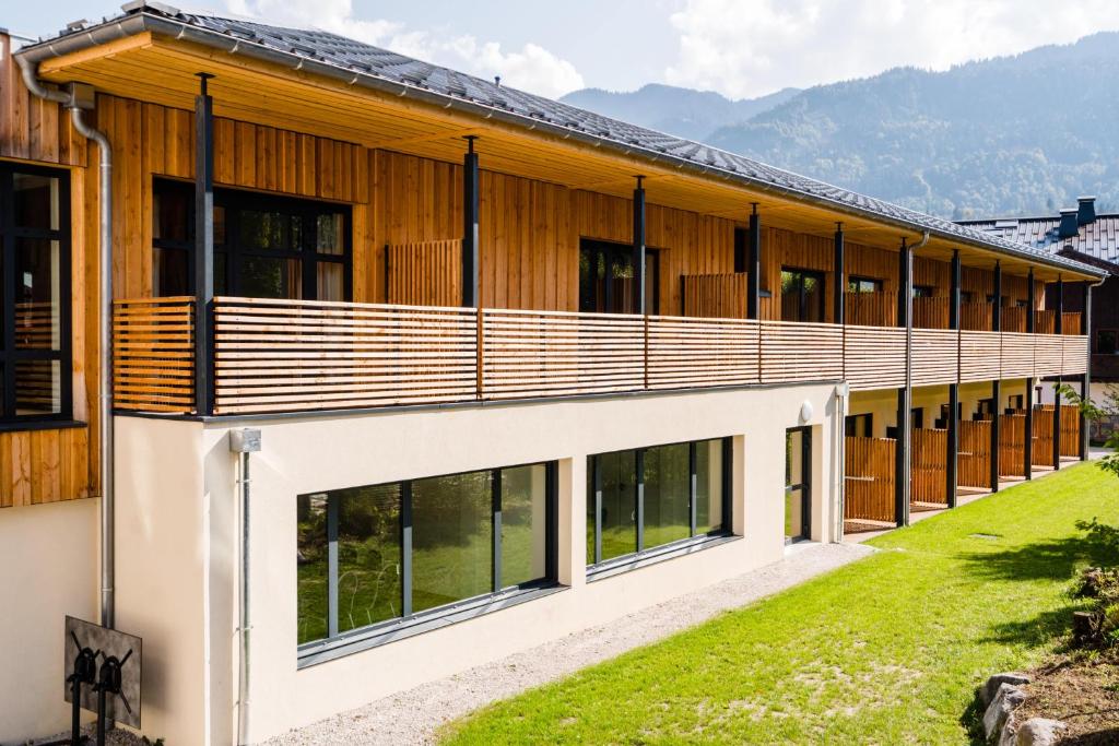 a building with large windows on the side of it at Village Vacances le Bérouze in Samoëns