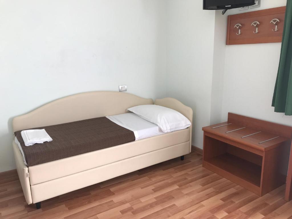 Postel nebo postele na pokoji v ubytování Hotel Donnini