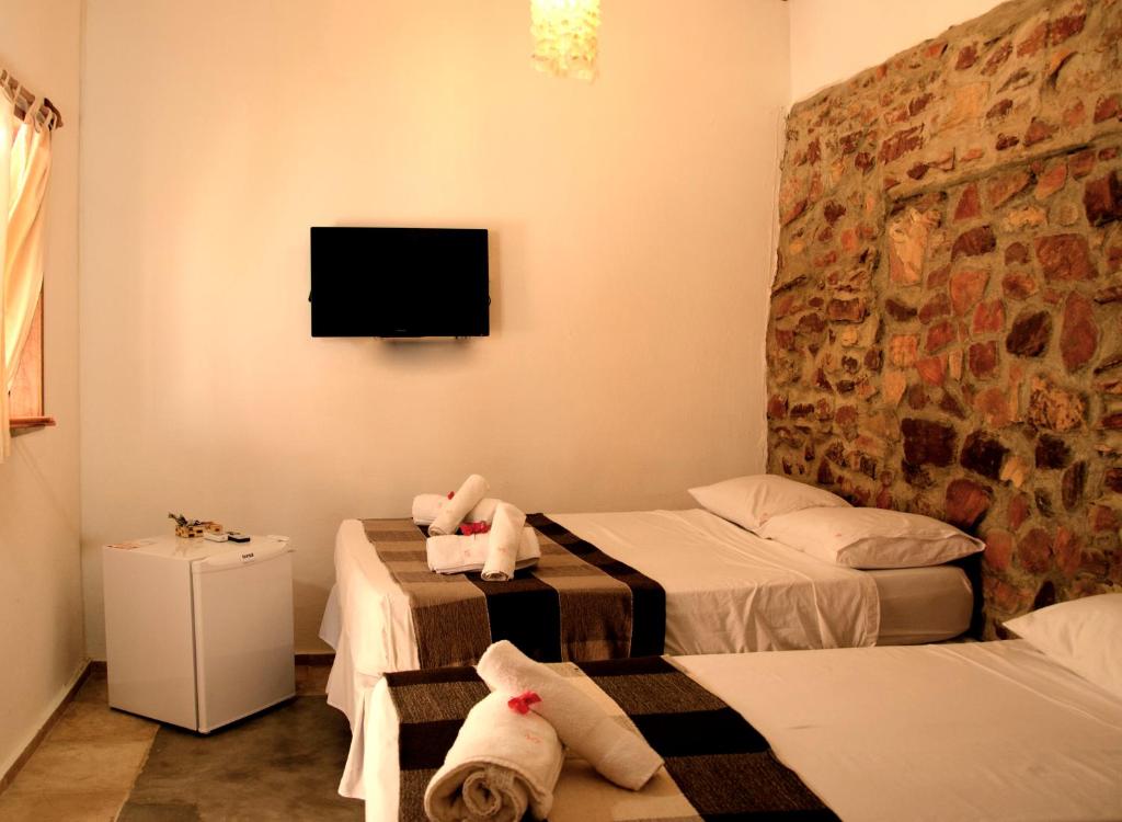 Cama ou camas em um quarto em Villa Chic Hostel Pousada