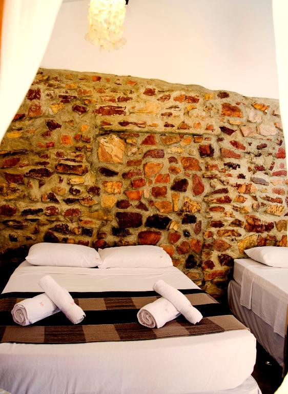 Cama ou camas em um quarto em Villa Chic Hostel Pousada