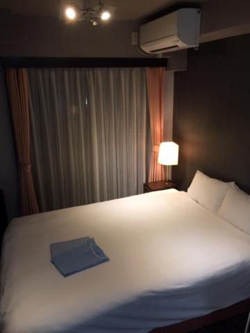 Cama o camas de una habitación en Hotel Business Villa Omori