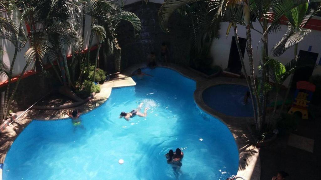 Bazén v ubytování Hotel Arena Caliente nebo v jeho okolí