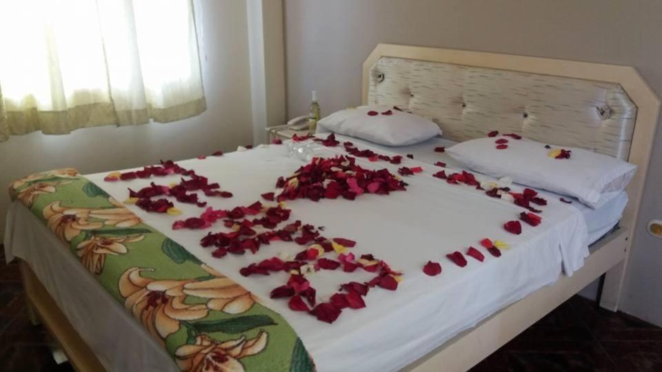 Postel nebo postele na pokoji v ubytování Hotel Arena Caliente