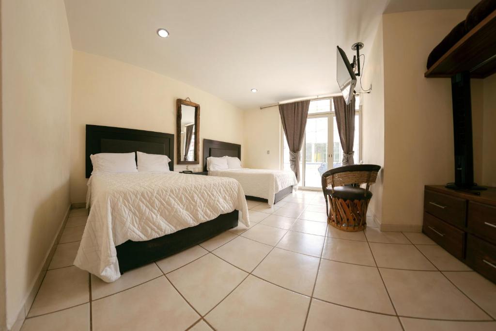 Postel nebo postele na pokoji v ubytování Coaranda Hotel Boutique