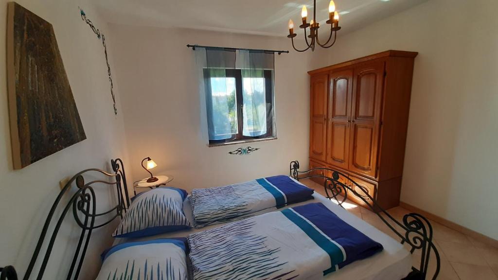 Postel nebo postele na pokoji v ubytování Villa Linet