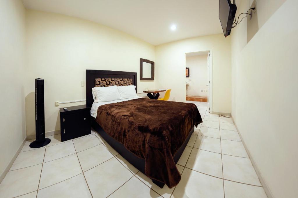 Postel nebo postele na pokoji v ubytování Coaranda Hotel Boutique
