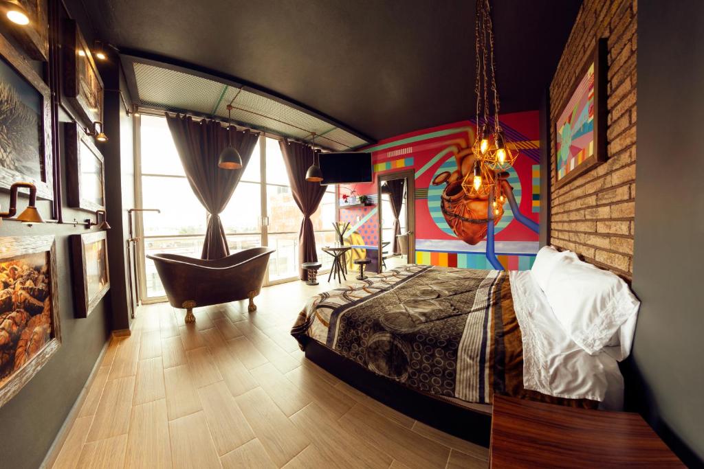 Postel nebo postele na pokoji v ubytování Coaranda Hotel Boutique