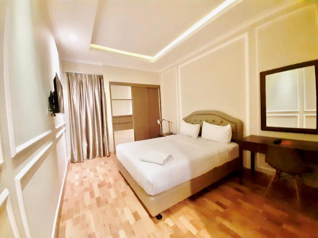 Postel nebo postele na pokoji v ubytování Flamboyan Residence Cipete