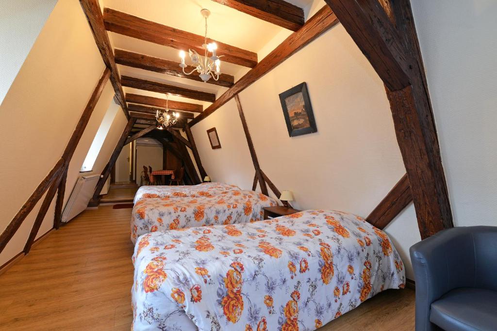 Postel nebo postele na pokoji v ubytování Hotel Restaurant Dontenville