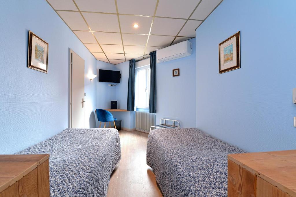 Postel nebo postele na pokoji v ubytování Hotel Restaurant Dontenville