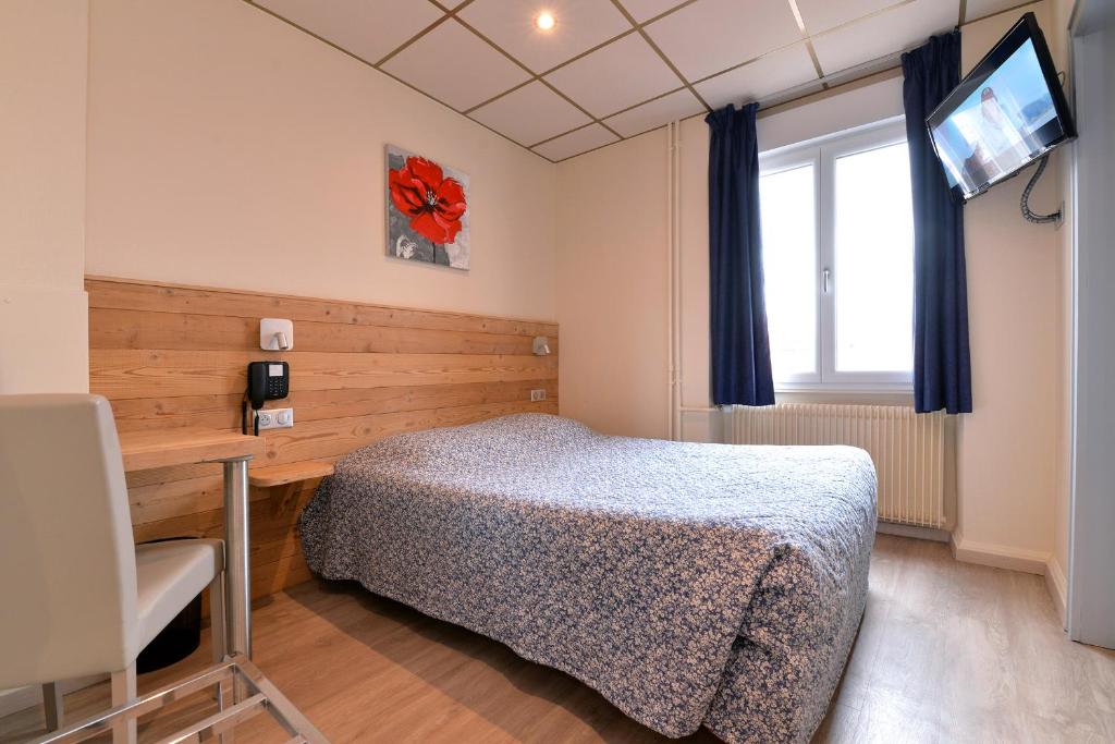 Postel nebo postele na pokoji v ubytování Hotel Restaurant Dontenville