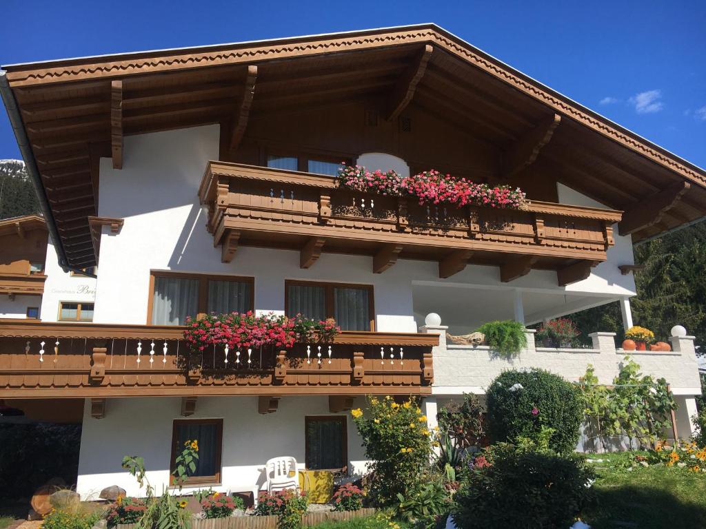 a large white building with flower boxes on its balconies at Haus Erler in Tux