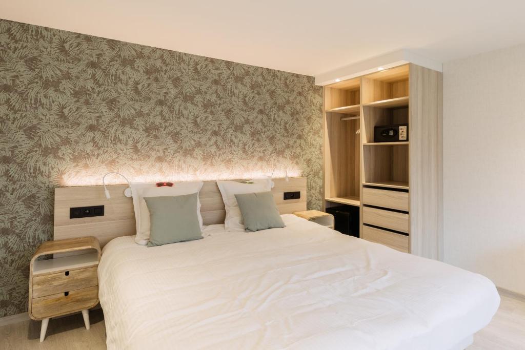 Postel nebo postele na pokoji v ubytování C-Hotels Helios