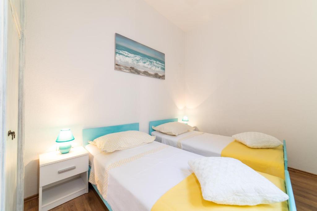 Posteľ alebo postele v izbe v ubytovaní Holiday Home Škeljo