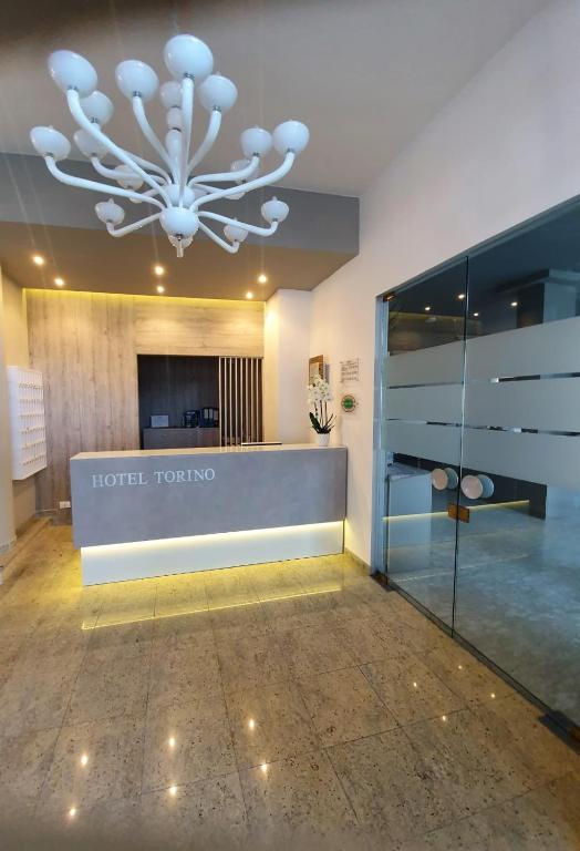 Kuchyň nebo kuchyňský kout v ubytování Hotel Torino