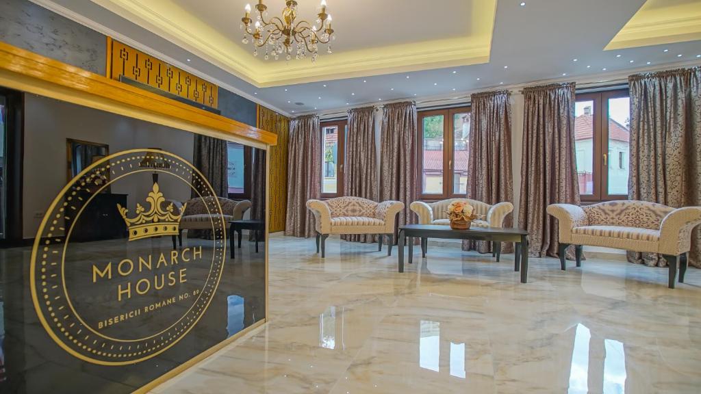 a meeting room with a sign for a montreal house at Monarch House in Braşov
