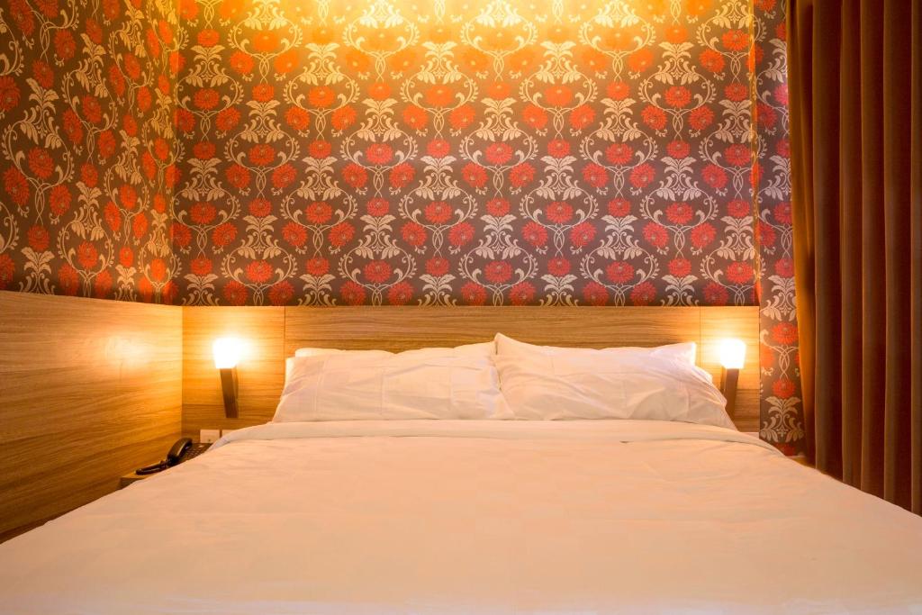 Postel nebo postele na pokoji v ubytování DeMira Hotel
