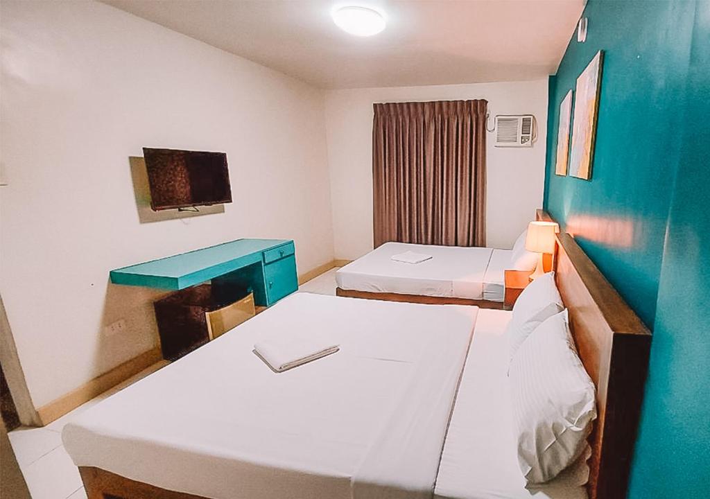 Postel nebo postele na pokoji v ubytování The NEST, Tagaytay
