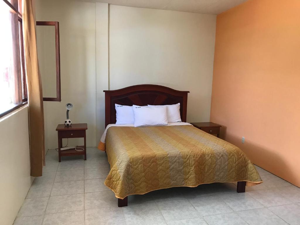 Postel nebo postele na pokoji v ubytování Hosteria Shell