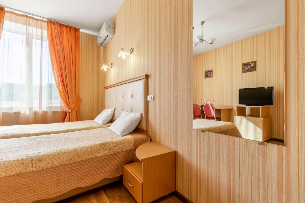 Postel nebo postele na pokoji v ubytování Гостиница Siesta Киев