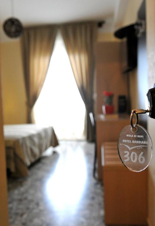 A bed or beds in a room at Hotel Gabbiano