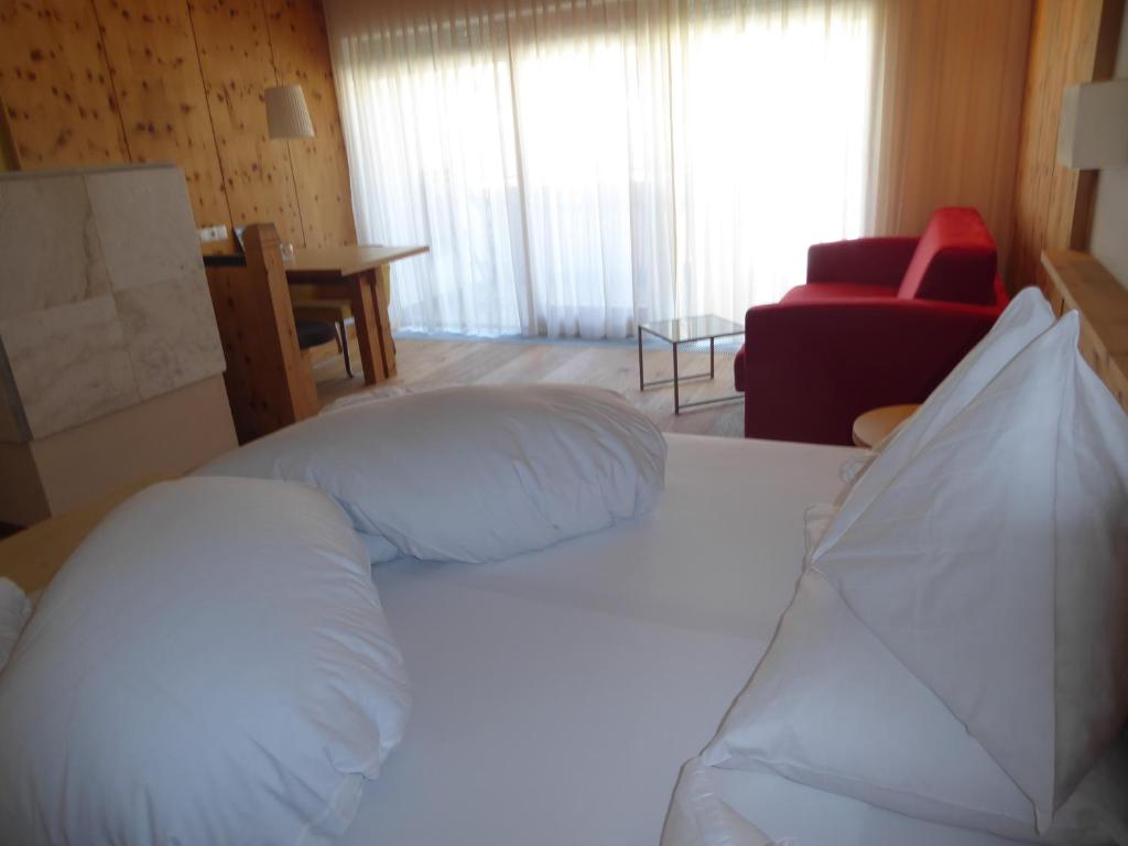 Postel nebo postele na pokoji v ubytování Sporthotel Rasen