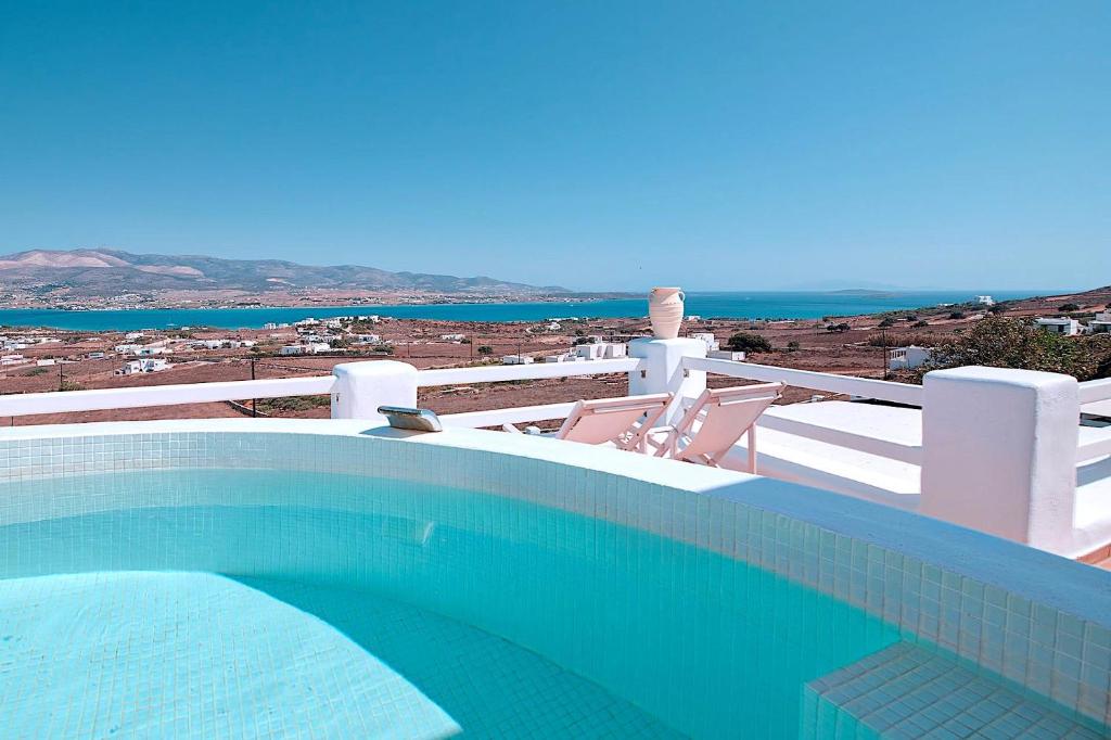 a swimming pool with a view of the ocean at Antiparos View in Antiparos
